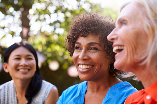 Group of older women with dental implants from Pacific Oral & Facial Surgery Center in Livermore, CA